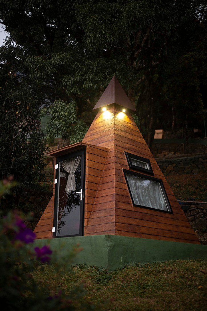 Unique Pyramid Hut at Cloud Cabana Holidays Vagamon offering a stylish and cozy camping experience.