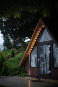 Interior of the Tiny House at Cloud Cabana Holidays Vagamon, designed for an intimate and stylish stay with essential amenities.