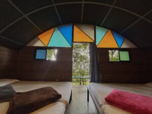 Interior of the Tent House at Cloud Cabana Holidays Vagamon, offering ample space for group camping with cozy furnishings and a welcoming atmosphere.