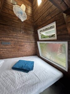 "Cozy Pyramid Hut at Cloud Cabana Holidays Vagamon with a unique design and comfortable interior, surrounded by scenic views.
