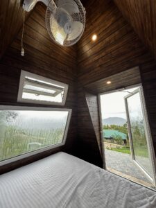 "Cozy Pyramid Hut at Cloud Cabana Holidays Vagamon with a unique design and comfortable interior, surrounded by scenic views.
