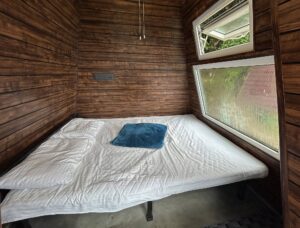 "Cozy Pyramid Hut at Cloud Cabana Holidays Vagamon with a unique design and comfortable interior, surrounded by scenic views.
