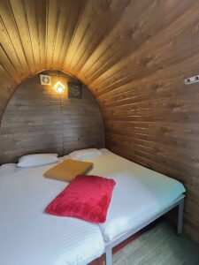 Charming Cozy Cabin at Cloud Cabana Holidays Vagamon, showcasing a snug living area with tasteful furnishings and a homely ambiance.