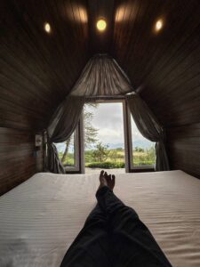 Cozy interior of Tiny House at Cloud Cabana Holidays Vagamon, featuring a neatly arranged living area with modern furnishings and efficient use of space.