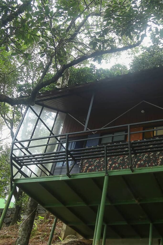 "Tranquil Forest Cabin at Cloud Cabana Holidays Vagamon surrounded by lush greenery for a peaceful retreat.