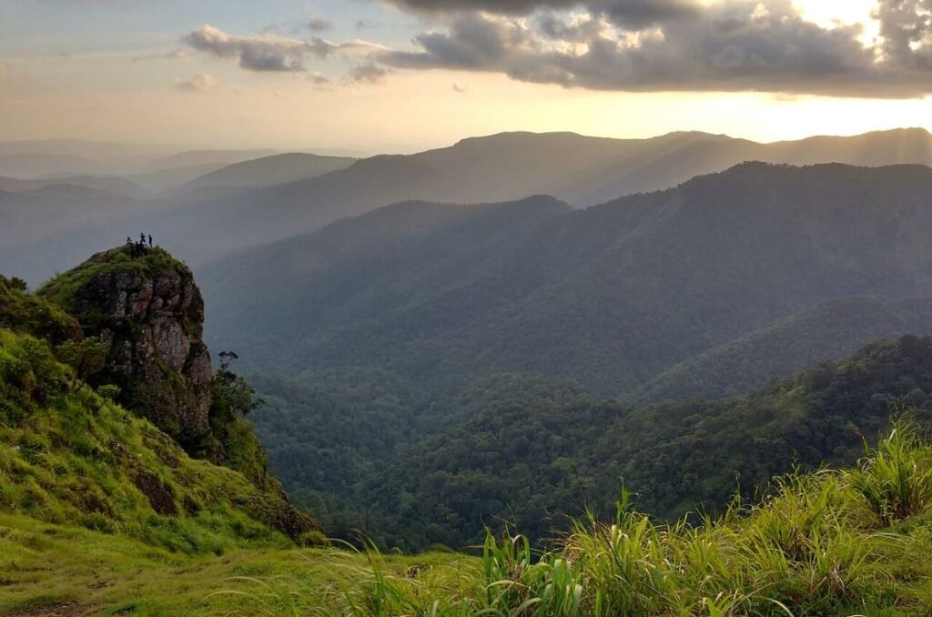 Stunning panoramic view of Parunthumpara, showcasing the dramatic cliffs and lush landscape at Cloud Cabana Holidays Vagamon.